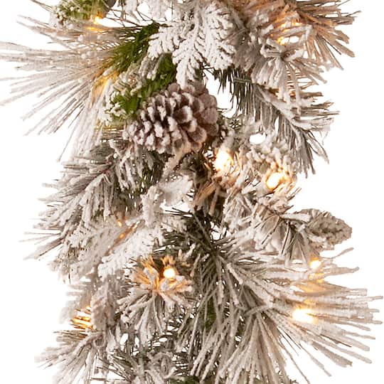 9ft. Pre-lit Snowy Bedford Pine Artificial Christmas Garland with Cedar Leaves, Red Berries, Mixed Cones & 70 Warm White Battery Operated LED Lights w/Timer